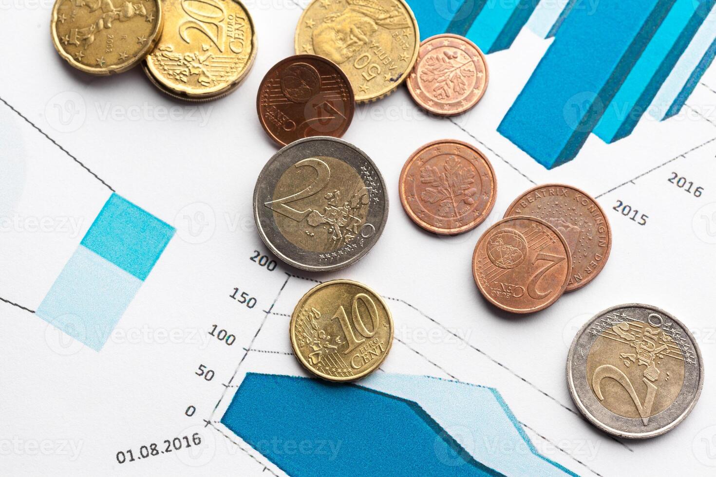 Graph Of Stock Market With Stacks Of Coins photo