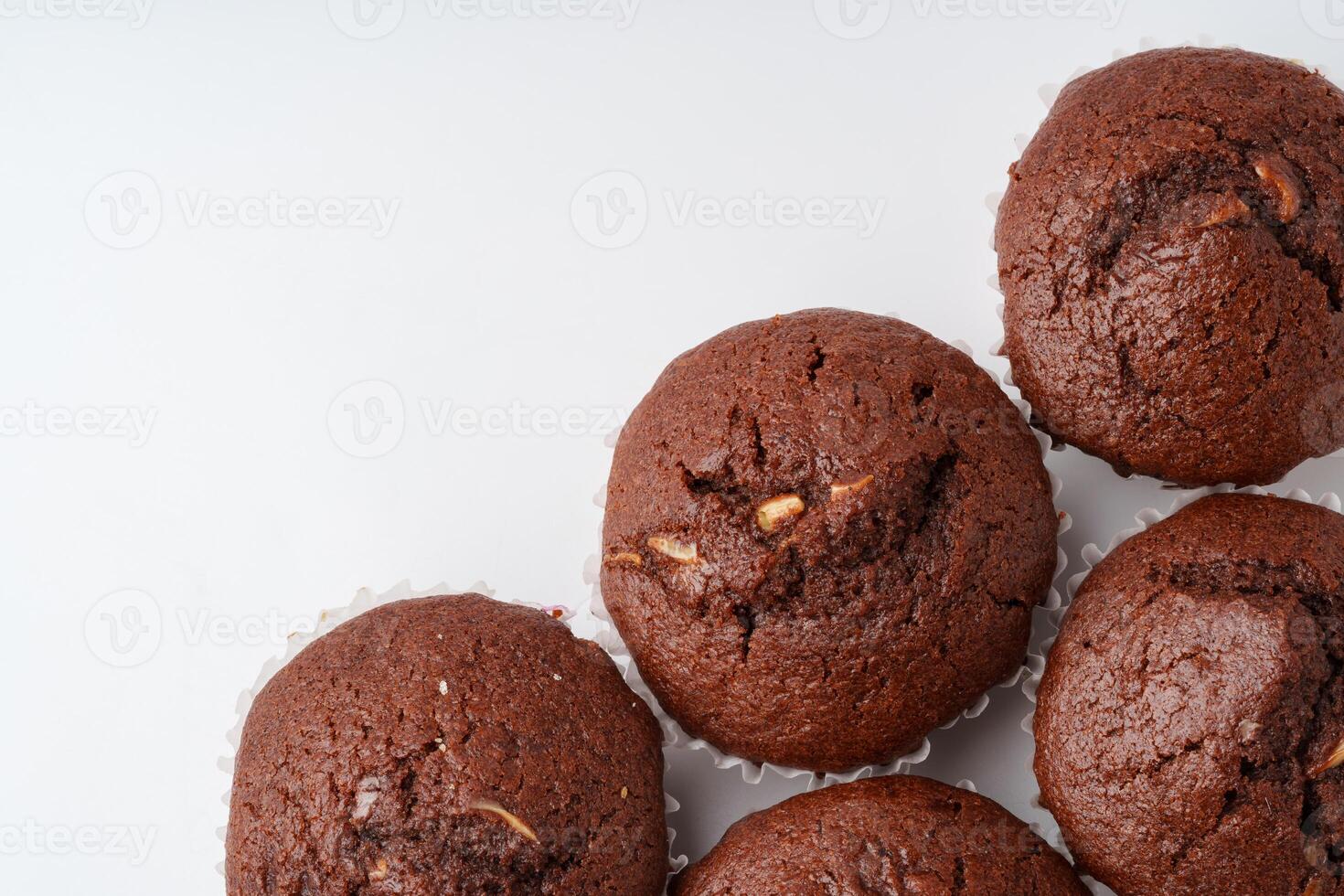 Delicious chocolate muffins arranged stylishly on a white background ready for dessert lovers at a bakery photo