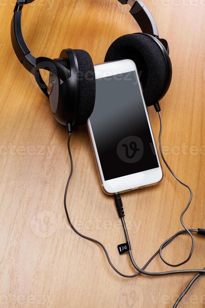 headphones on wooden background photo