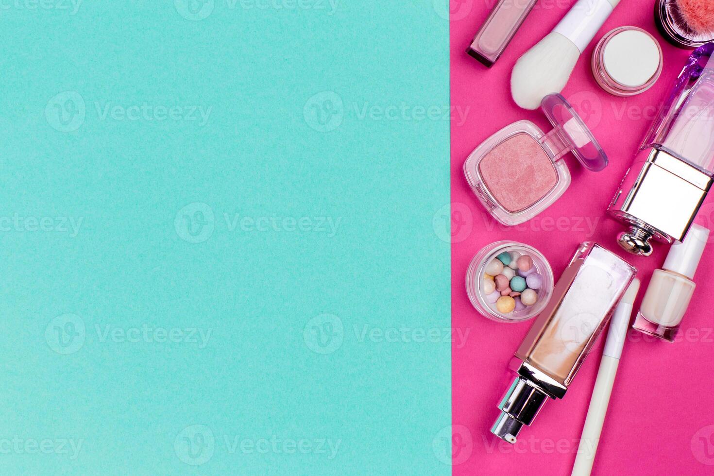 Set of colorful cosmetics on pink table photo