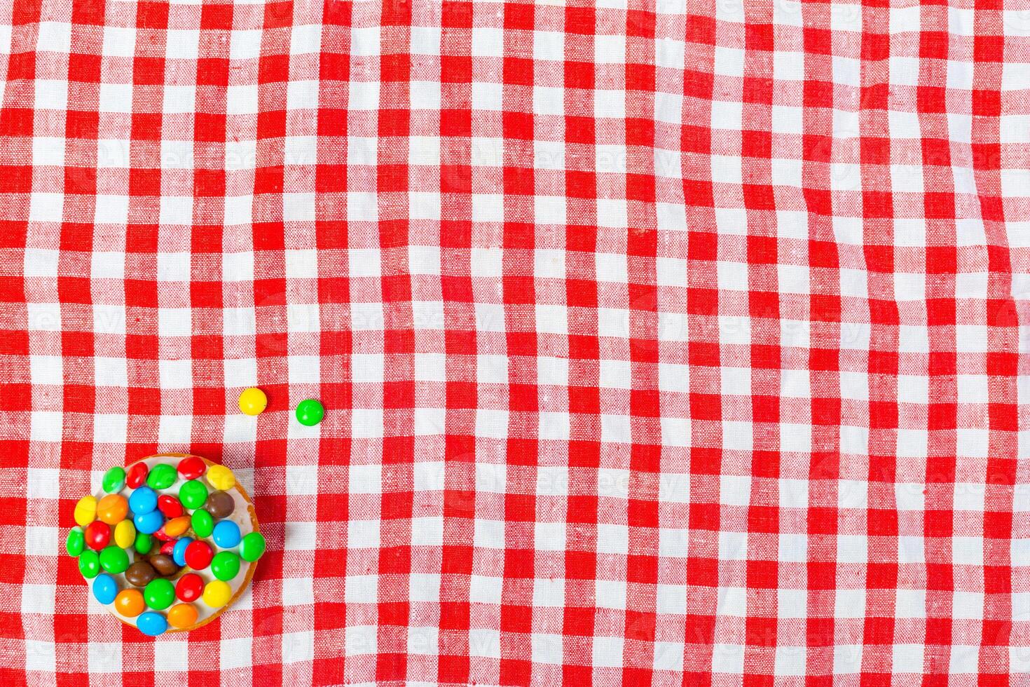 donut on a red table cloth. photo