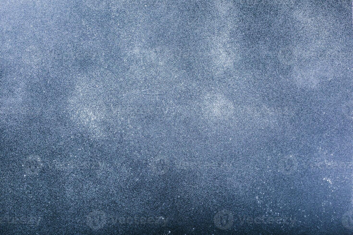 Dark wooden background with flour dust photo