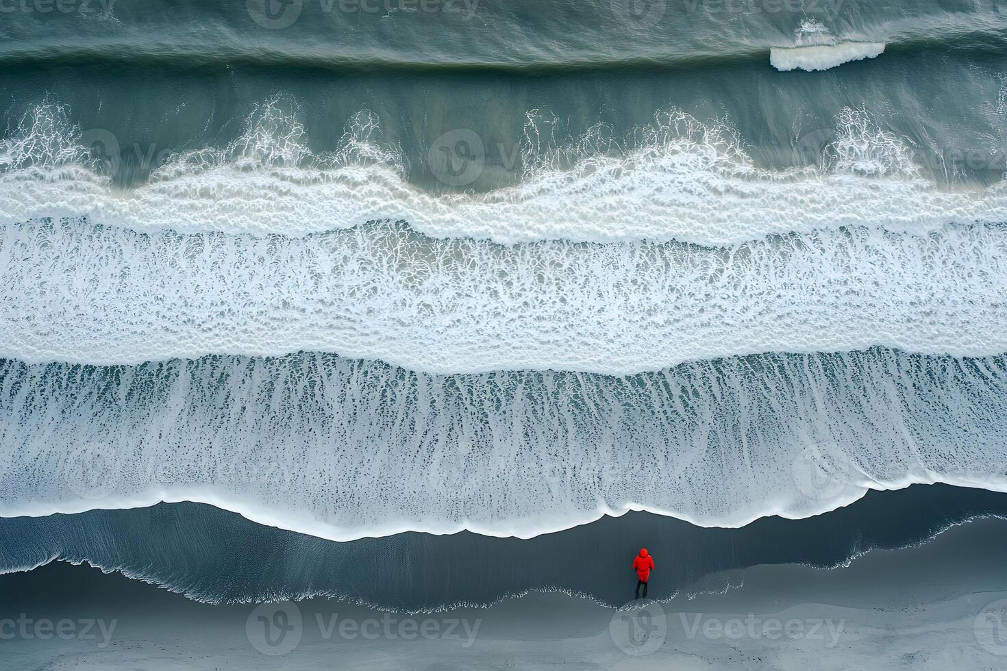 Solitude by the Sea Overhead View of Lone Figure in Red on Tranquil Beach photo