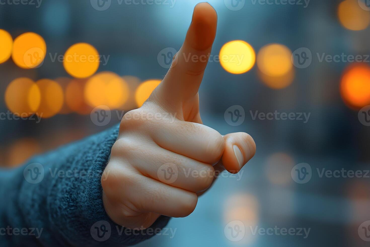 Human Hand Pointing Gesture in Urban Night Setting for Communication Design photo