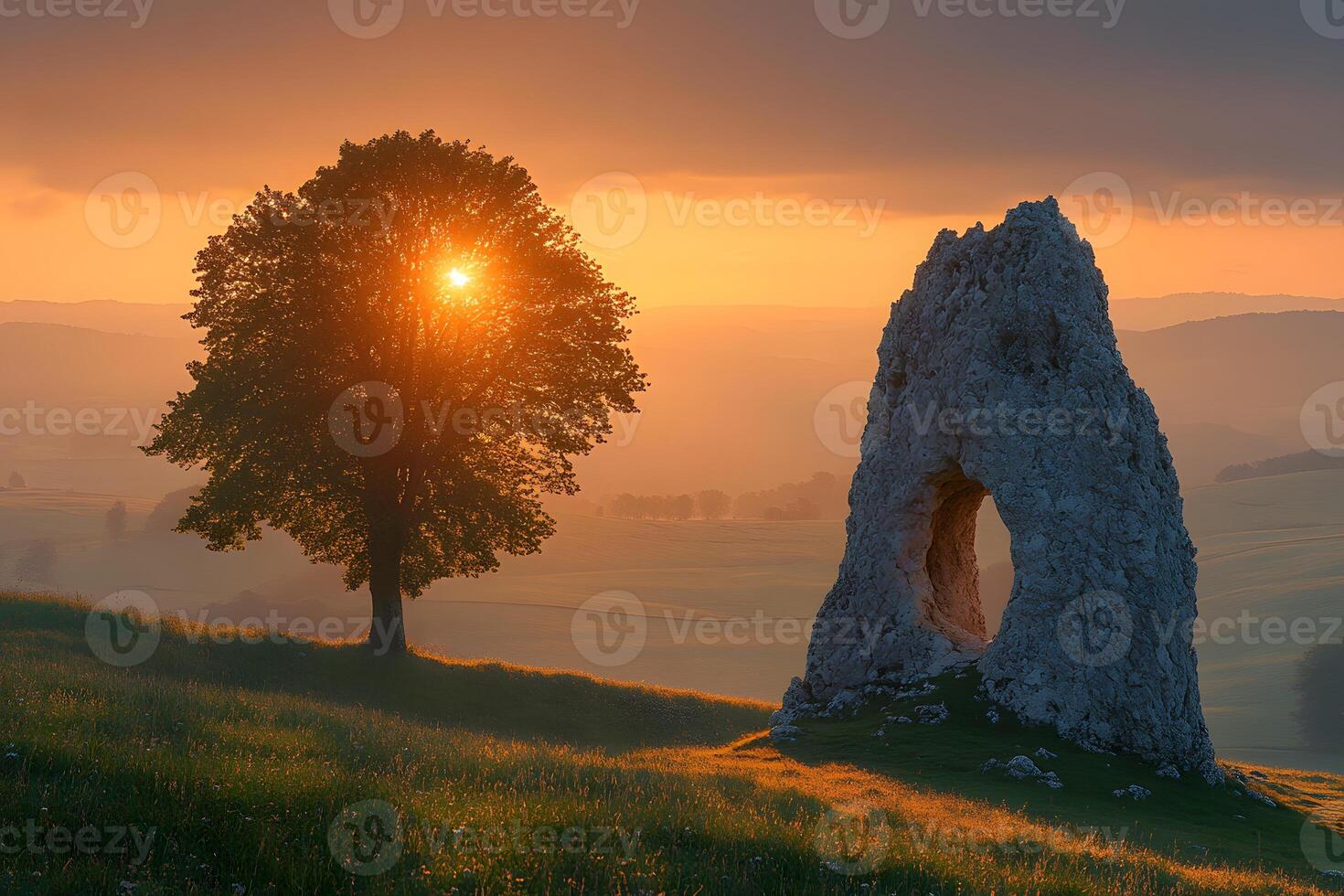 Serene Sunrise Landscape with Lone Tree and Ancient Stone Structure photo