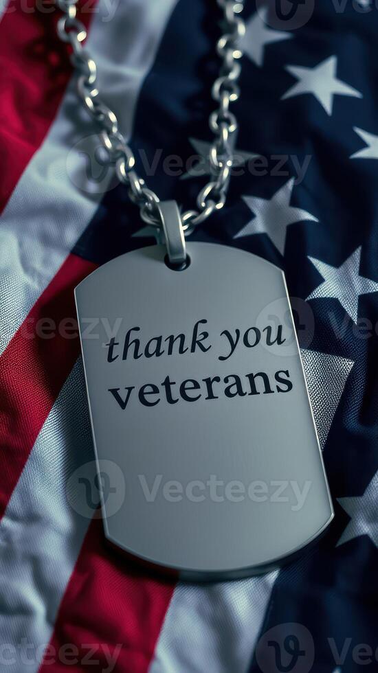 Thank you veterans displayed on a dog tag resting on an American flag photo