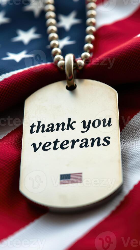 Dog tag expressing gratitude to veterans against a backdrop of an American flag photo
