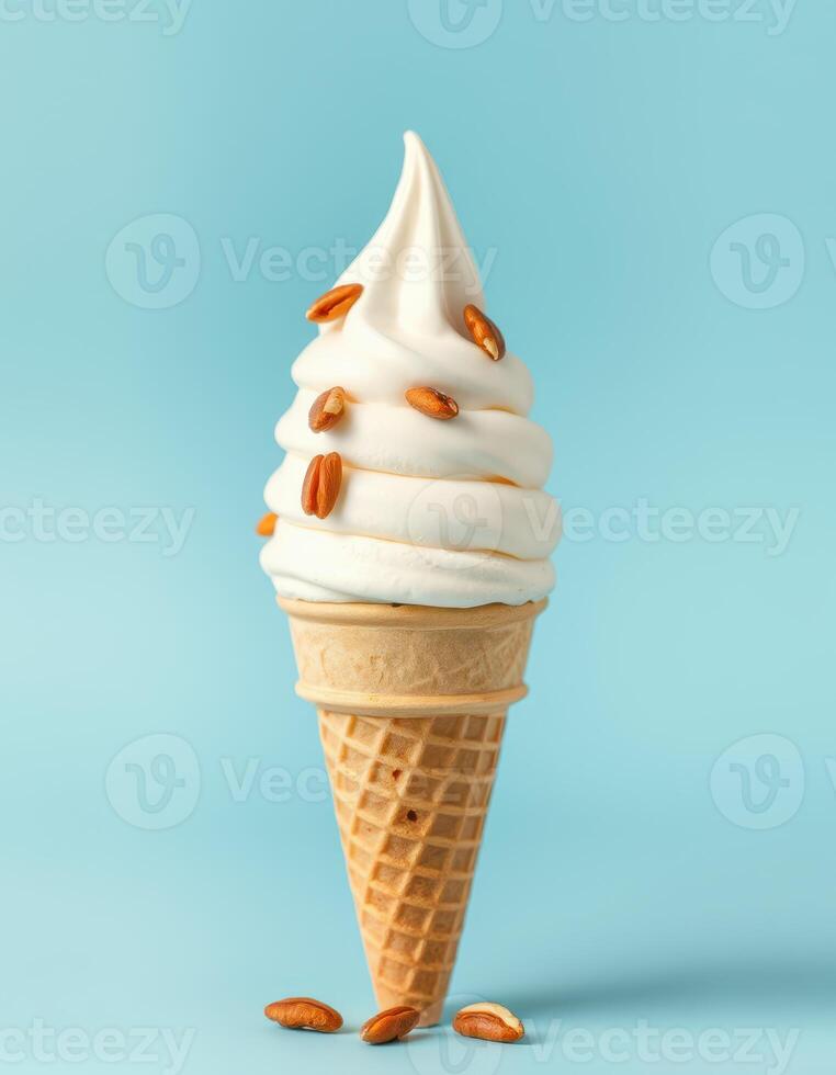 Creamy soft serve ice cream topped with crunchy seeds in a cone against a blue background photo
