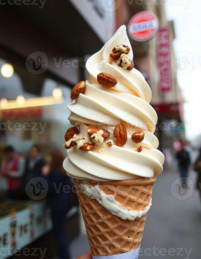 Delicious soft serve ice cream topped with nuts enjoyed on a bustling city street in cool weather photo