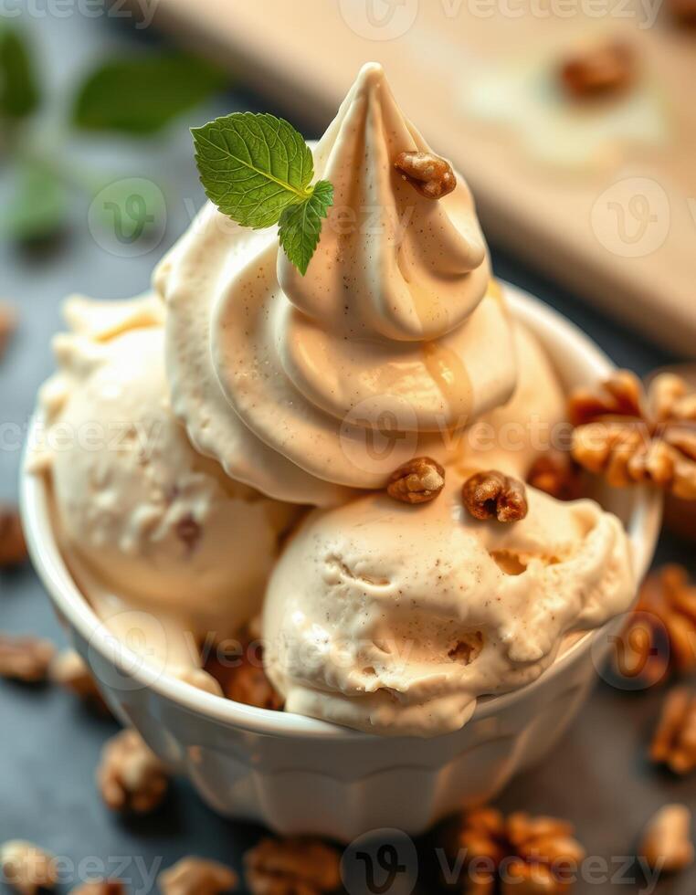 Delicious creamy ice cream topped with nuts and mint on a rustic table photo