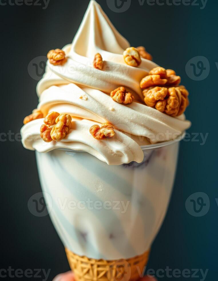 Delicious soft serve ice cream topped with caramel popcorn served in a cone photo