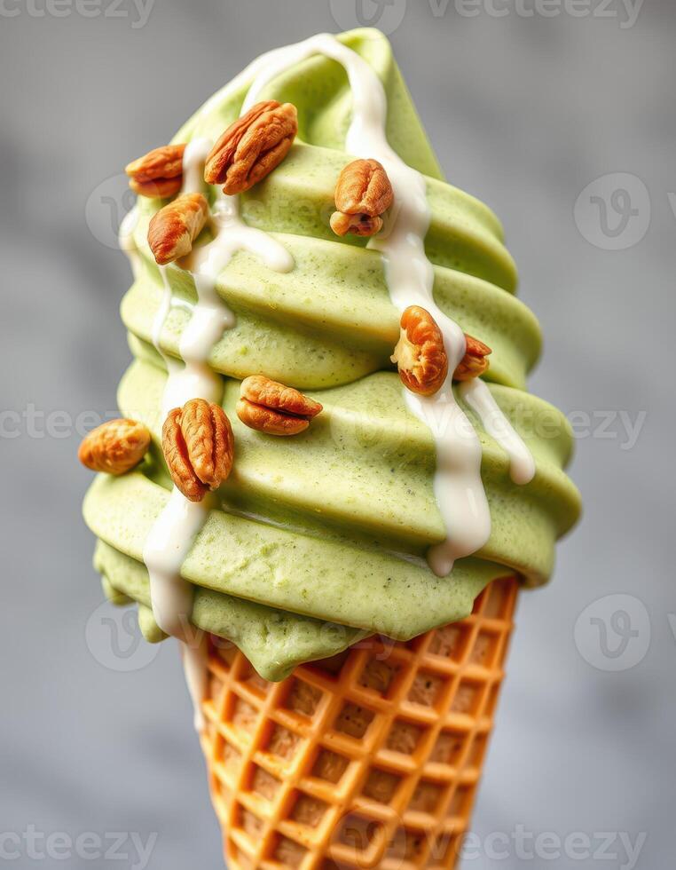 Delicious matcha soft serve ice cream topped with nuts in a waffle cone photo