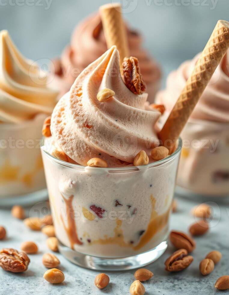 Creamy frozen dessert in a glass topped with crunchy nuts and accentuated by waffle cones served in a delightful arrangement photo