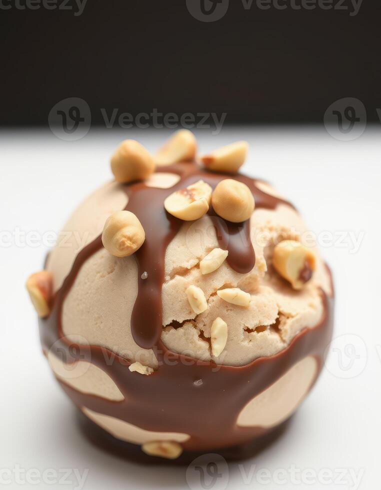 Delicious ice cream scoop topped with chocolate sauce and crushed nuts on a clean surface photo