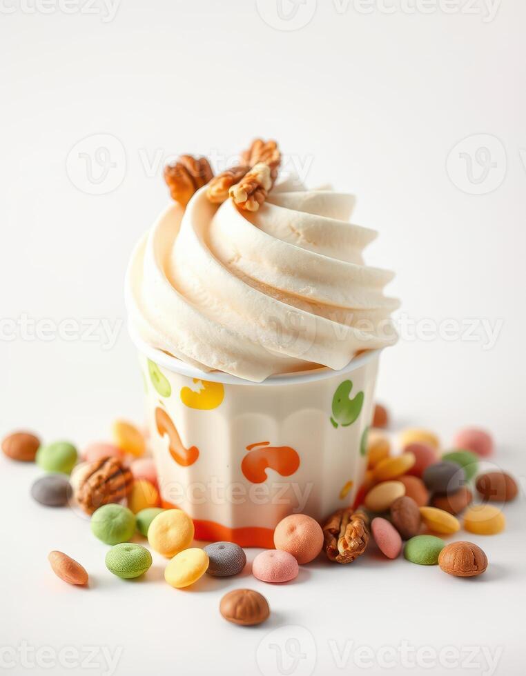 Delightful creamy dessert topped with nuts surrounded by colorful candies on a bright background photo