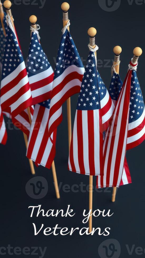 Colorful display of small American flags honoring veterans against a dark background photo