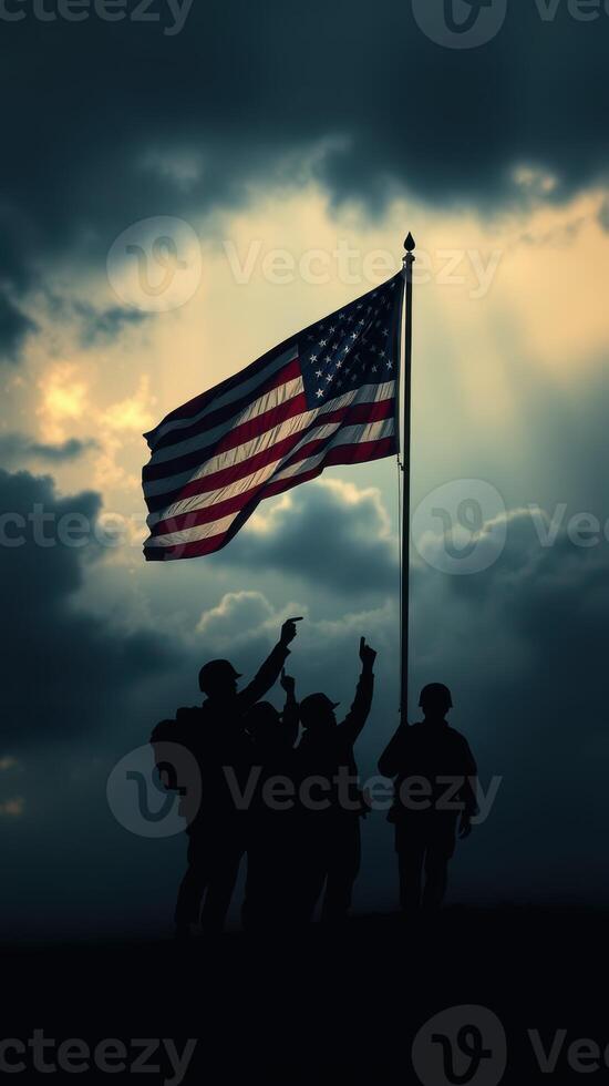 Soldiers celebrate the American flag against a dramatic, cloudy sky during a commemorative event at dusk photo