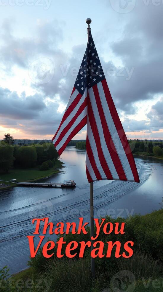 Flag waving above serene river landscape at sunset while honoring veterans with gratitude message photo