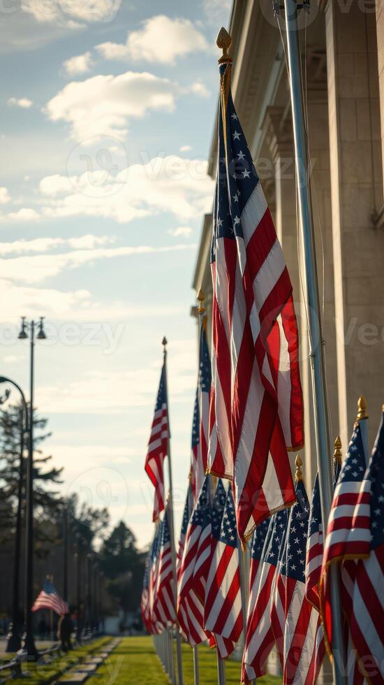 Flags wave proudly in the sunlight at a historical monument, showcasing patriotism and community spirit in the early evening hours photo