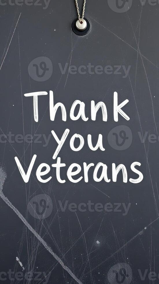 Sign expressing gratitude to veterans on a chalkboard background during a commemorative event photo