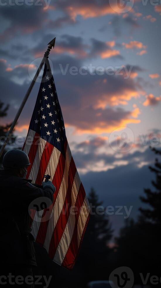 Soldier holding American flag during sunset with dramatic cloud formations in the background photo