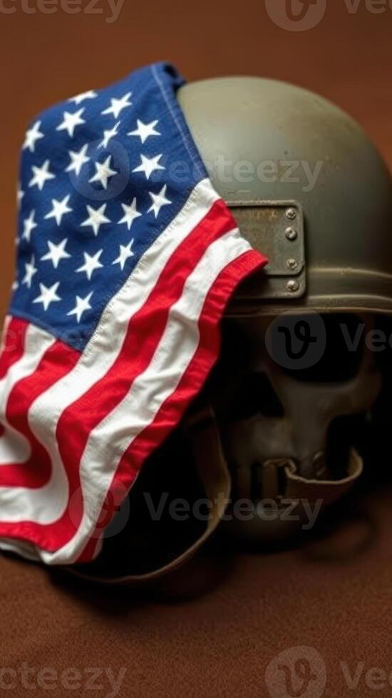 Military helmet adorned with an American flag draped over a skull on a wooden surface in dim lighting photo