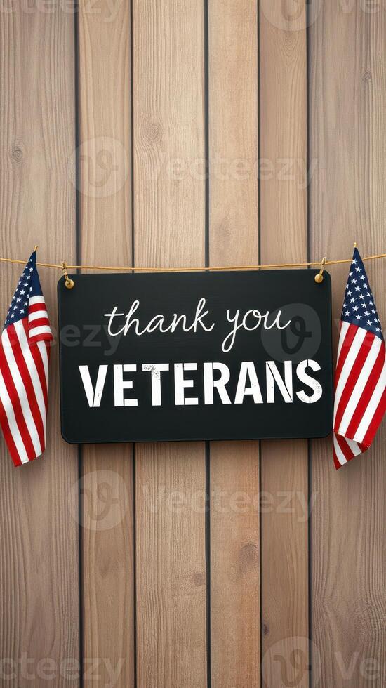 Thank you veterans sign with American flags displayed on wooden background in a tribute setting photo