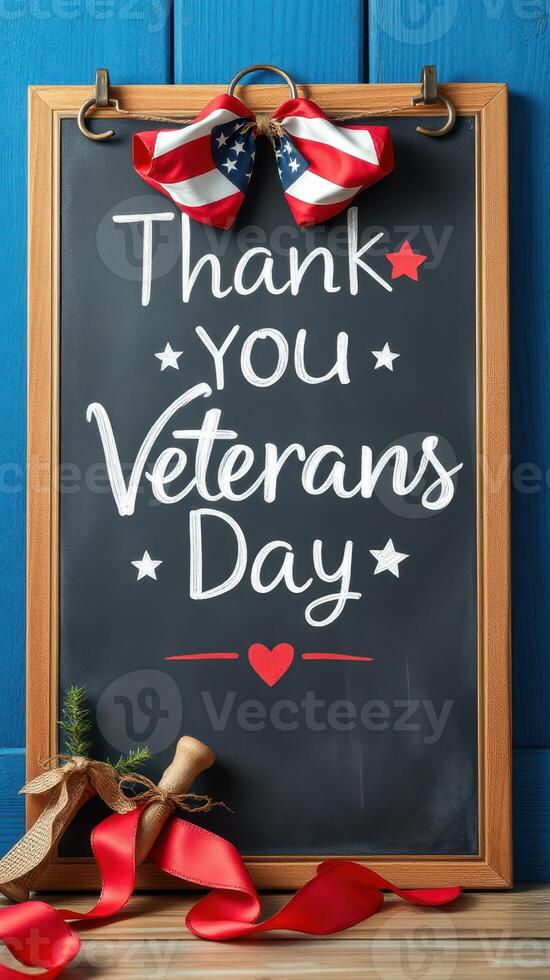 Decorative chalkboard sign expressing gratitude for Veterans Day with festive red and blue accents hanging indoors photo
