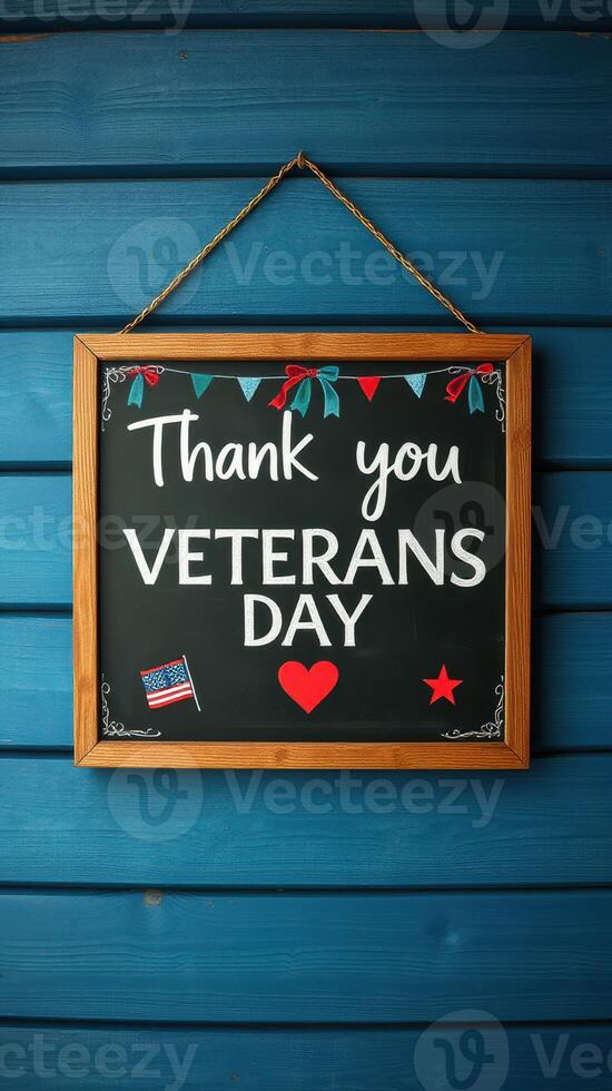 Thank you Veterans Day sign with patriotic decorations displayed on a blue wooden background photo