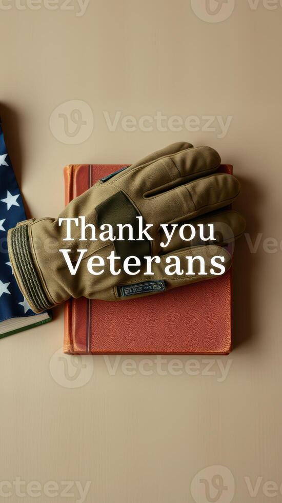 Veterans appreciation display featuring gloves, a book, and an American flag on a neutral background photo