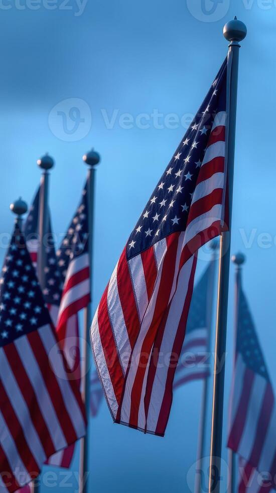 American flags waving majestically under a cloudy sky during a serene twilight moment photo