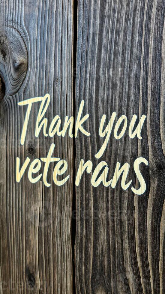 Thank you veterans sign made from dark wood with engraved lettering in a rustic style photo