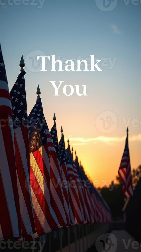 Sunset view of American flags with a message of gratitude at a memorial site photo