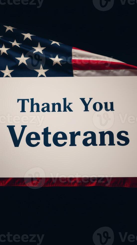 Sign expressing gratitude to veterans with American flag in the background during a commemorative event photo