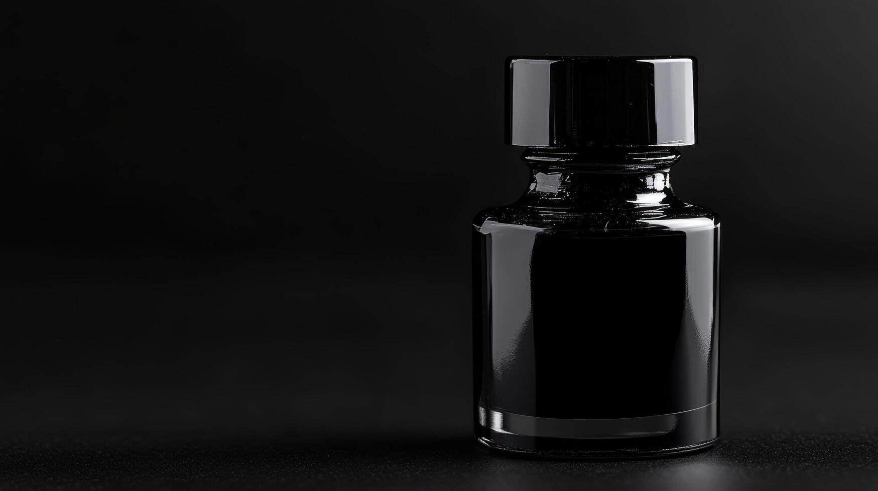 Black ink bottle stands out against a dark background, showcasing sleek design and glossy finish, perfect for artistic creations photo