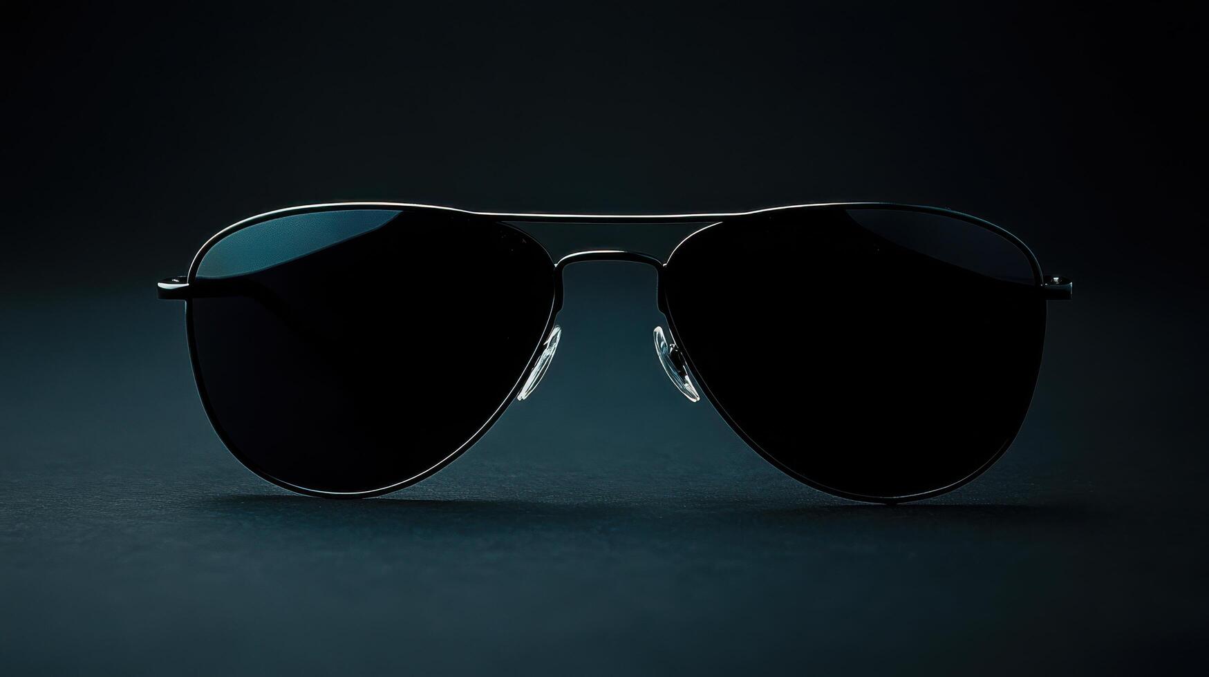 Stylish black sunglasses on a dark background showcasing modern design and elegance for fashion enthusiasts photo