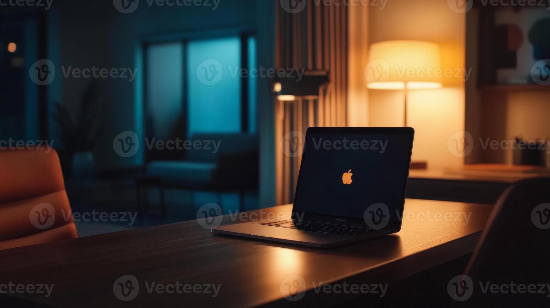 Laptop on a Table in a Dimly Lit Room. photo