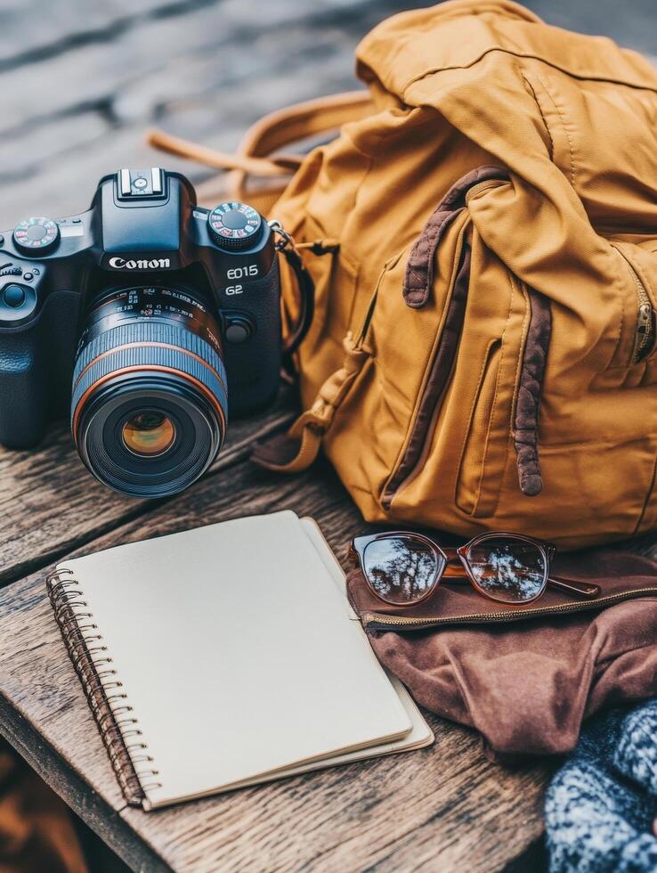 Camera, Backpack, and Notebook Preparing for a Journey. photo