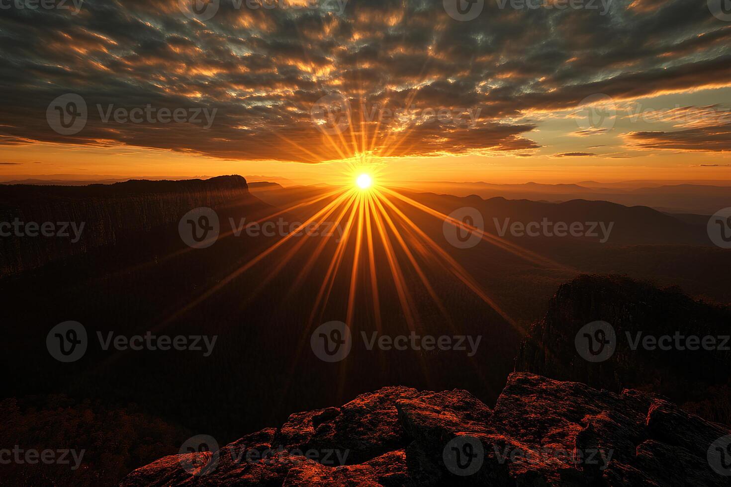 A beautiful sunset casting light over a mountain range, creating a picturesque atmosphere. photo