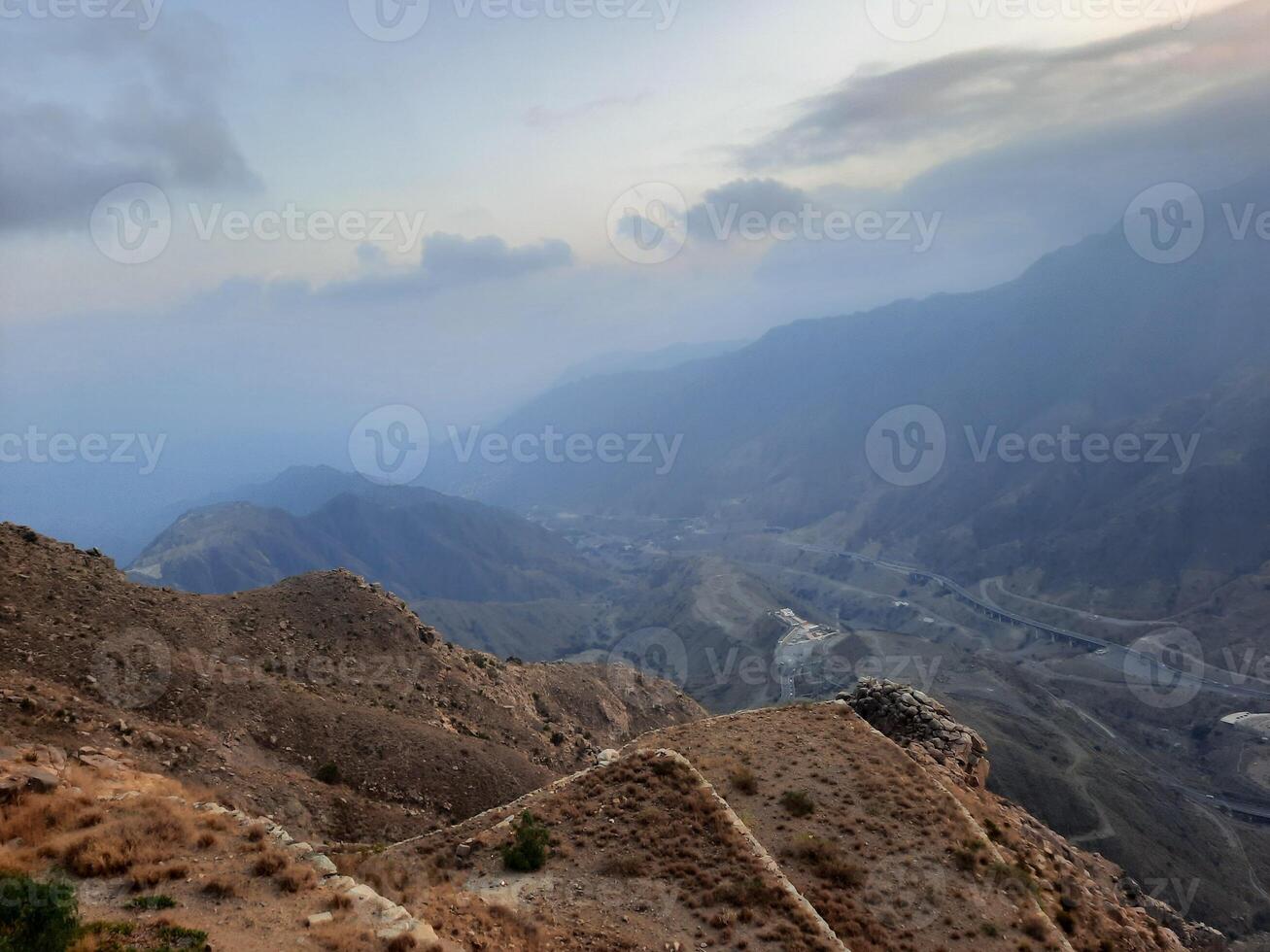 Stunning sunset panorama of the hills surrounding Abha city as seen from High City, Abha. photo