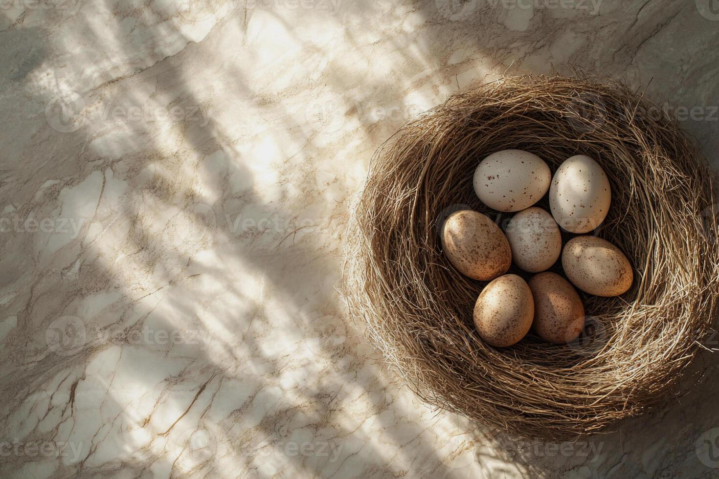 A nature-inspired nest cradles softly colored eggs in golden light. This artistic Easter arrangement combines organic textures with a refined aesthetic, ideal for seasonal inspiration. photo
