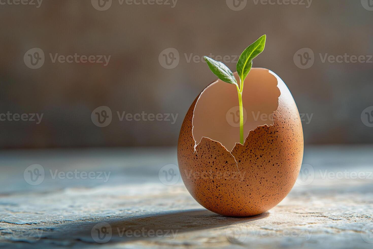 A green sprout emerges from a fragile eggshell, embodying transformation, resilience, and sustainability. The soft focus background enhances the organic beauty of this symbolic and artistic image. photo