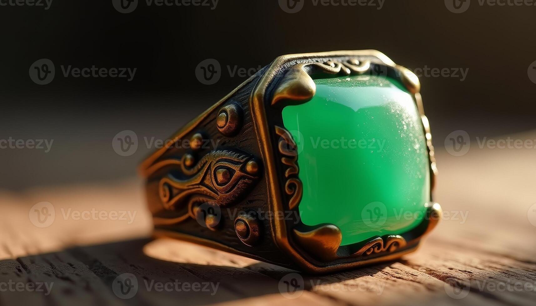 Intricate emerald stone ring with vintage brass detailing under sunlight photo