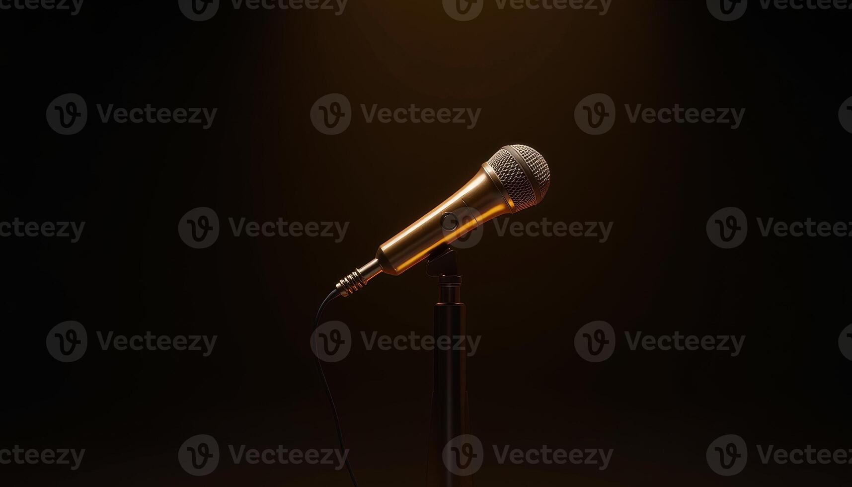 Golden microphone stands alone under soft spotlight in a darkened space photo