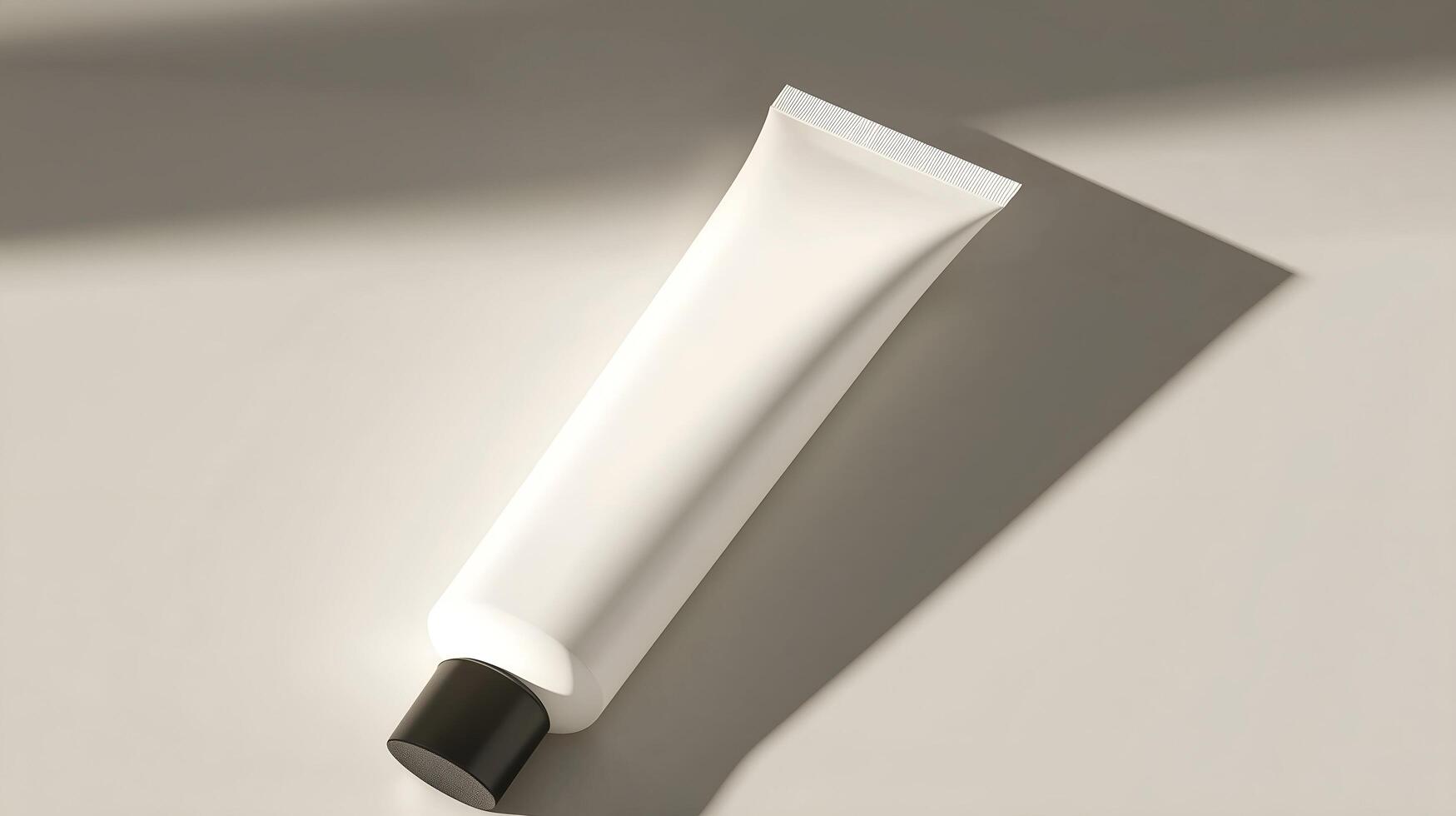 a tube of cream on a table with a shadow photo