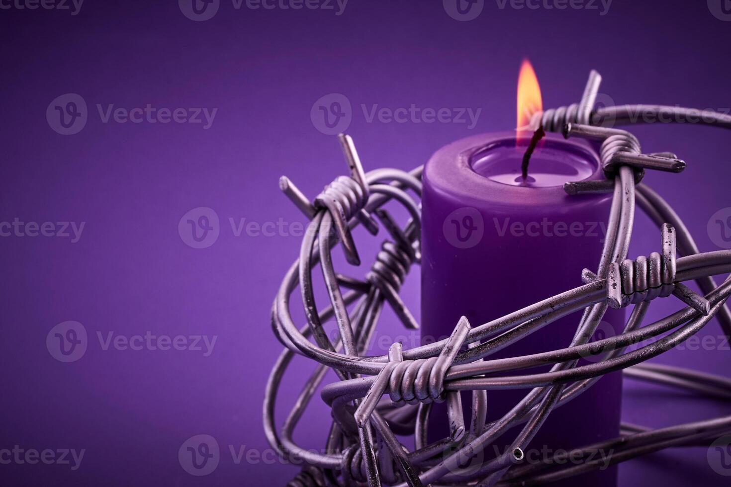 Holocaust memorial day. Candle and Barbed Wire photo
