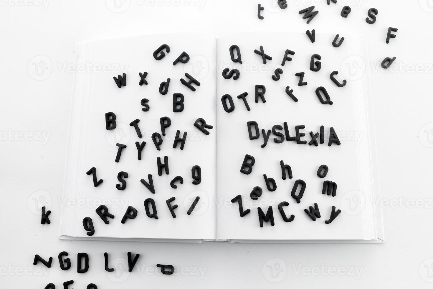 Dyslexia concept. Book filled with jumbled letters photo