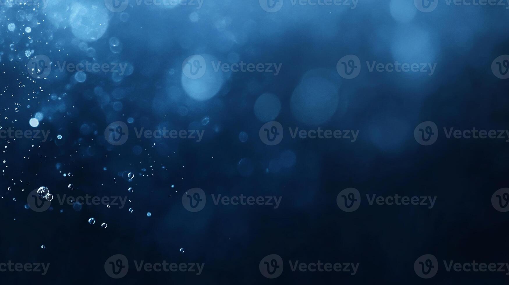 Abstract blue bokeh background with sparkling particles and blurred lights. photo