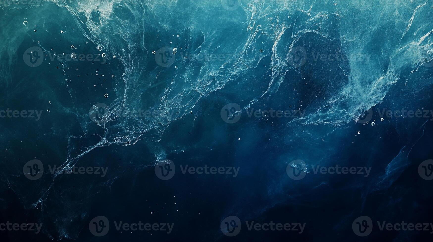 Abstract ocean texture with swirling deep blue water and air bubbles. photo