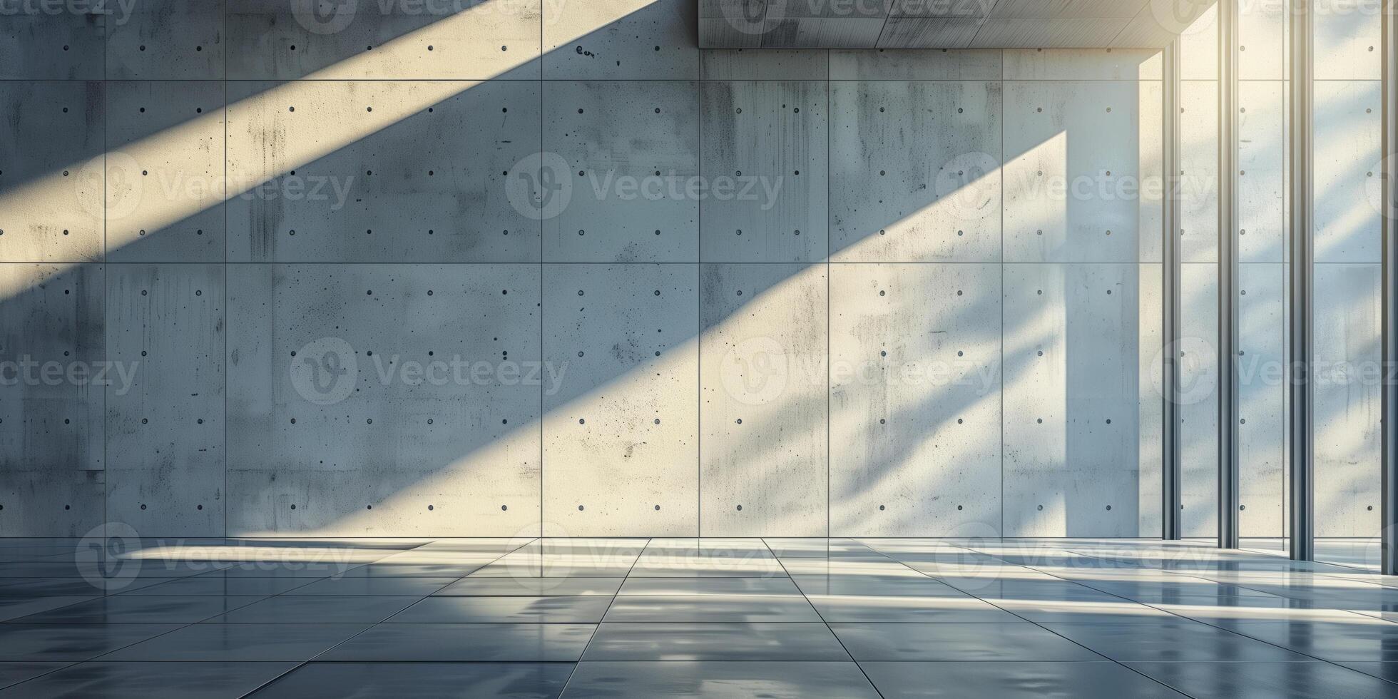 Empty modern interior with polished concrete walls and floors, illuminated by natural sunlight casting geometric shadows through large floor-to-ceiling windows photo